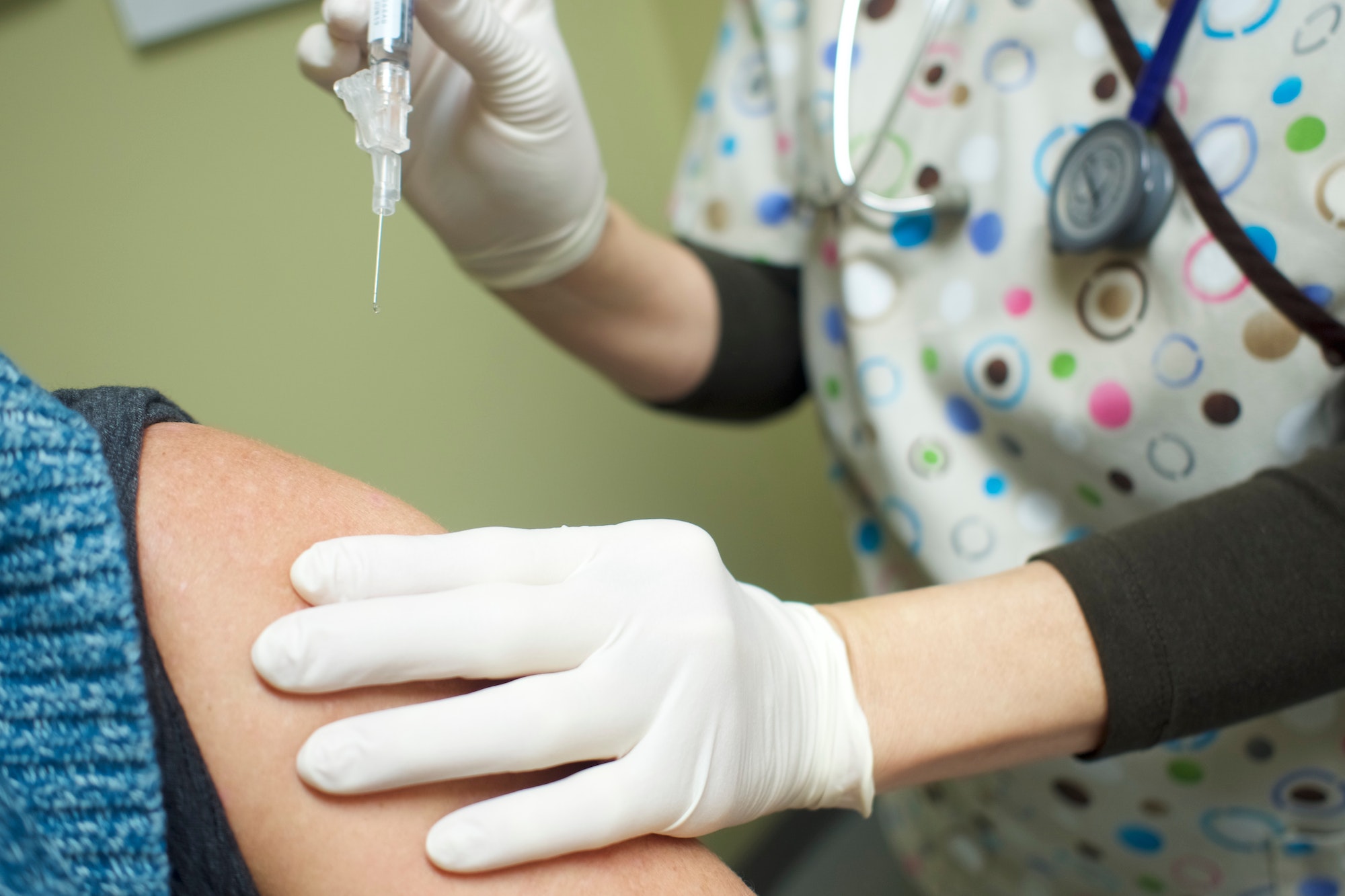Nurse administering Covid vaccine